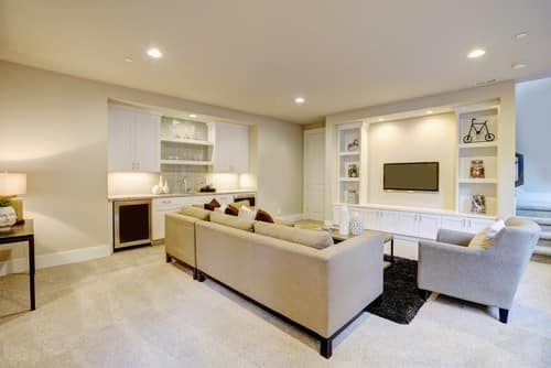 Chic,Basement,Features,A,Gray,Sectional,Facing,A,White,Built-in